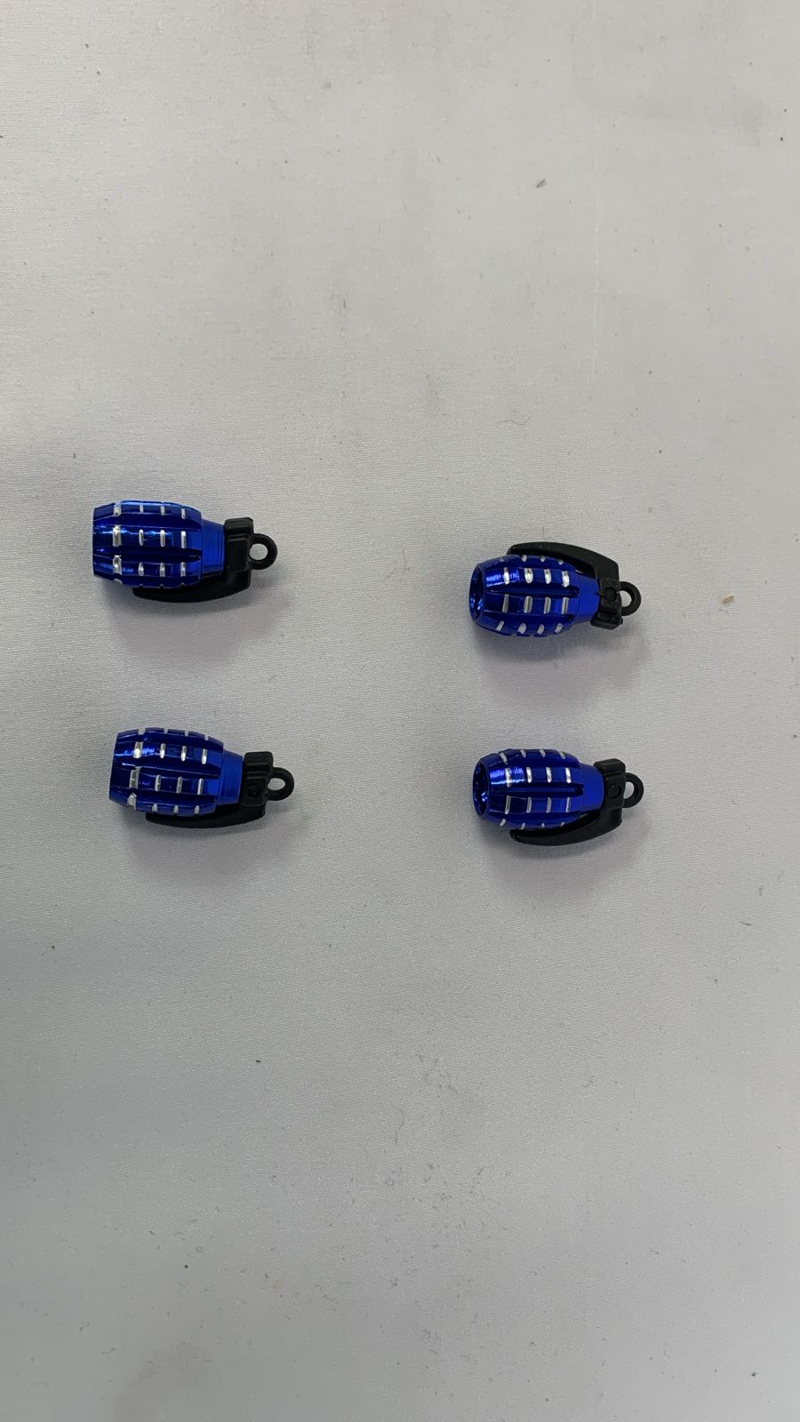 Blue grenade valve caps