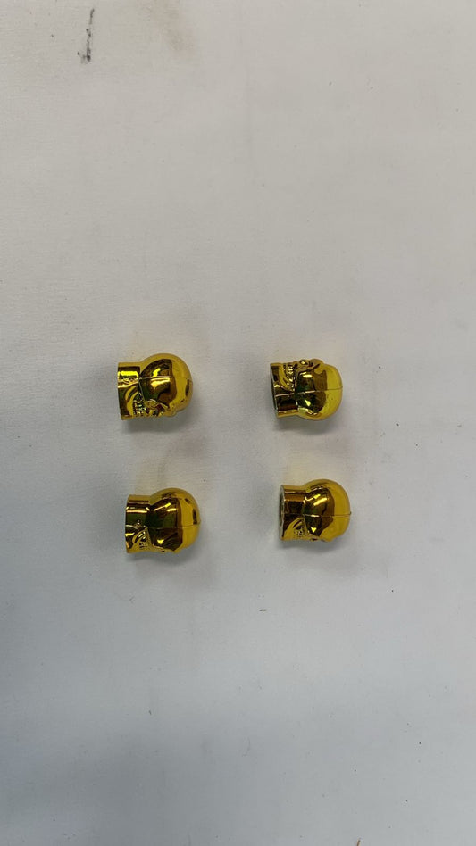 Golden valve cap skull head