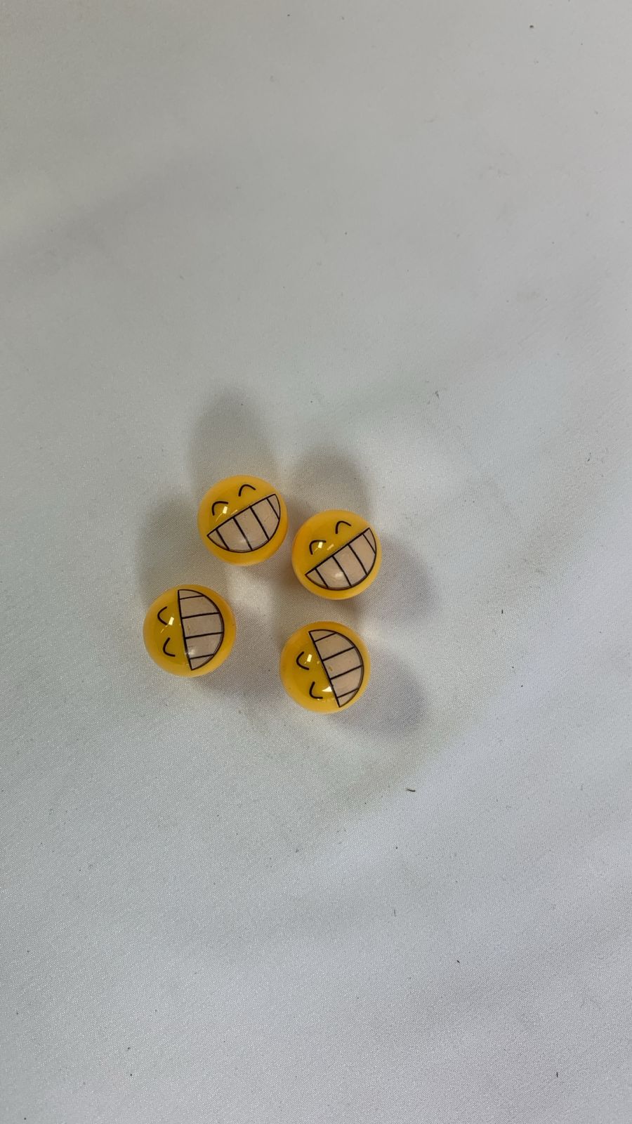 Grinning face valve caps