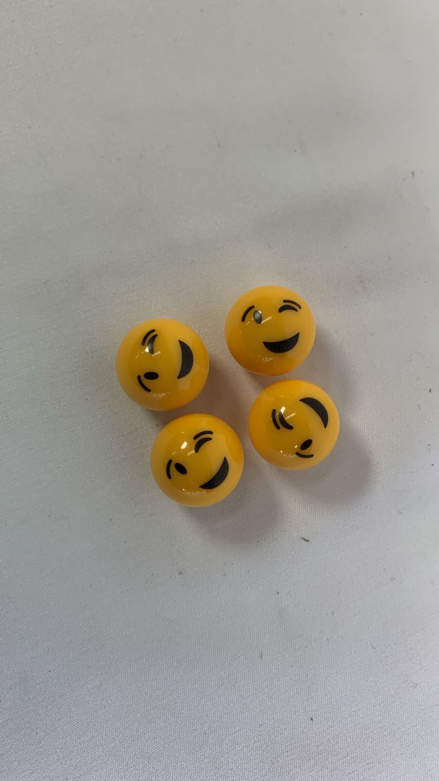 Winky face valve caps