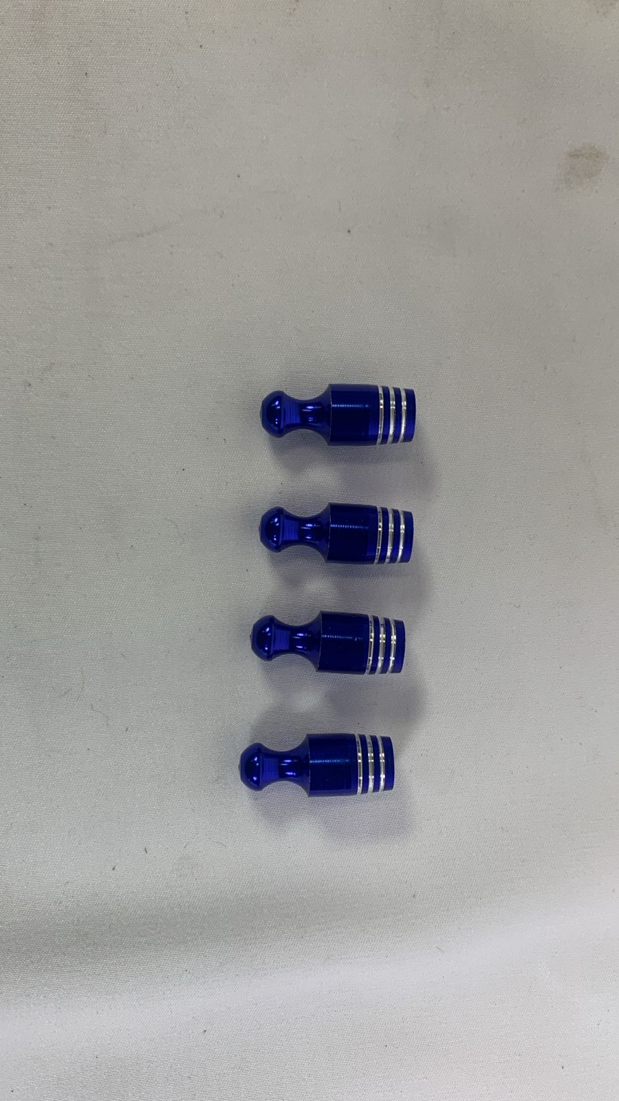 Blue valve caps bowling pins